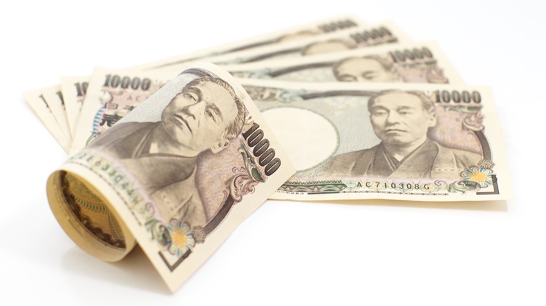 Japanese Yen bank notes on white background