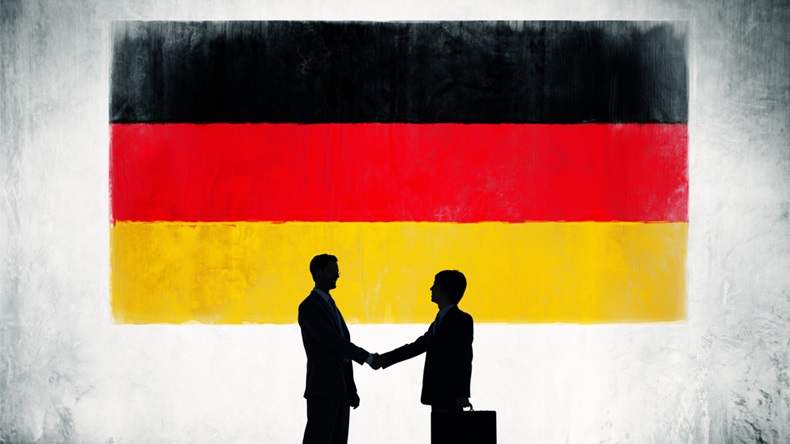 Business People Shaking Hands With Flag of Germany