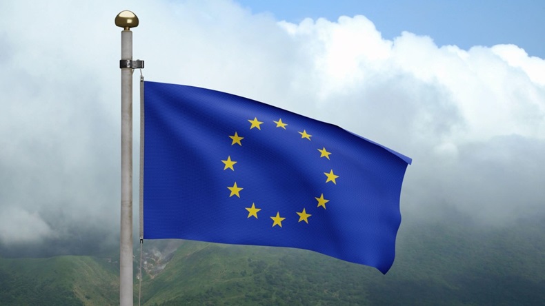 EU European Union flag waving in wind at mountain