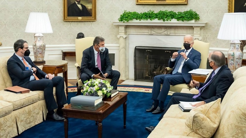 US President Joe Biden hosts West Virginia Senator Joe Manchin in the White House Oval Office to discuss his vote on Biden's Build Back Better Infrastructure initiative