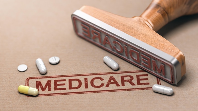 3D illustration of a rubber stamp with the text Medicare and pills over paper background