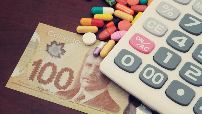 100 CAD bill with pile of pills and calculator