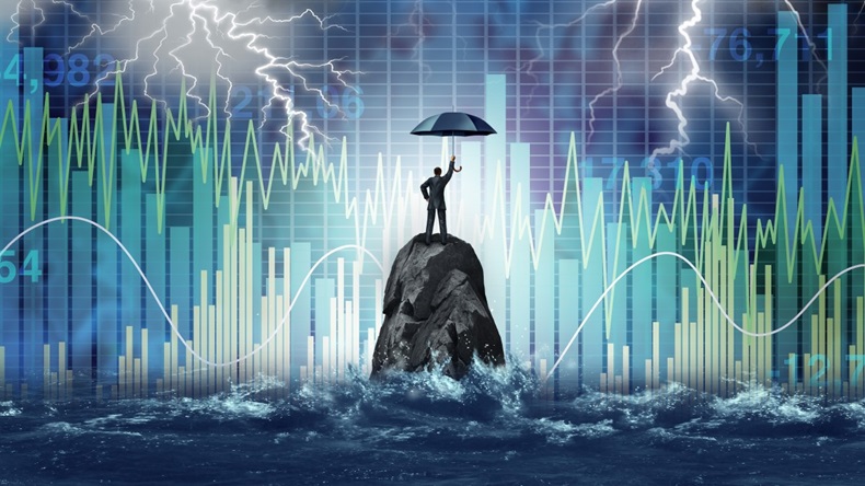 Businessman standing on rock in sea with umbrella, protecting business during turbulent times, financial background