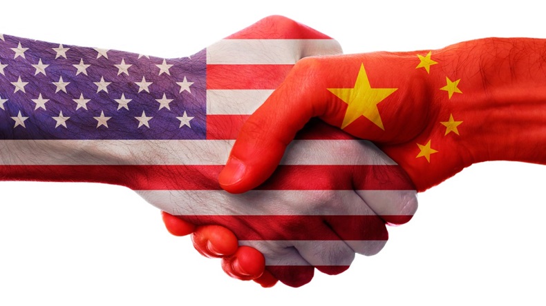 Deal handshake with US and China flags