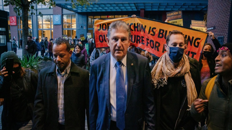 Senator Joe Manchin is confronted by climate activists leaving his boat on his way to Capitol Hill