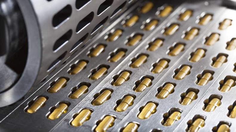 Close up of capsules on a production line