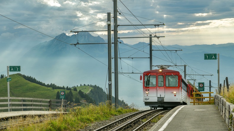 Train approaching train station on top of Mount Rigi in canton of Schwyz, Switzerland