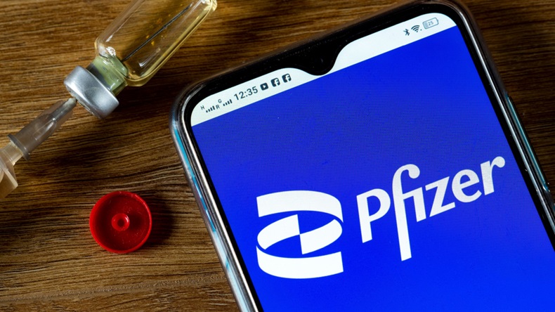 Pfizer logo next to syringe
