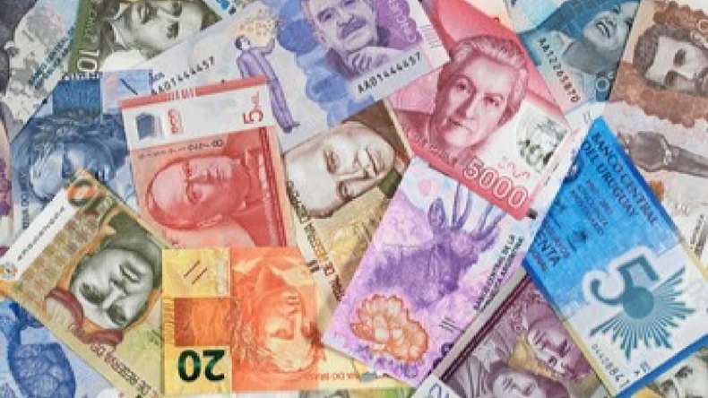 An arrangement of various South America currency notes covering the frame