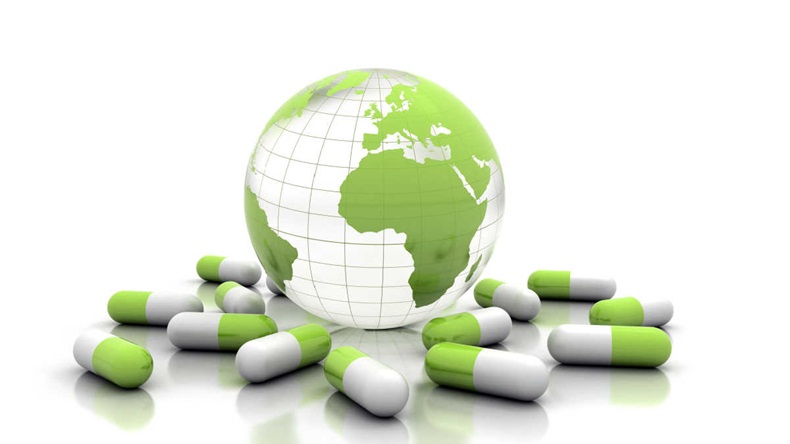3-d Render of a globe centring on Africa and Europe, surrounded by green and white capsules against a white background
