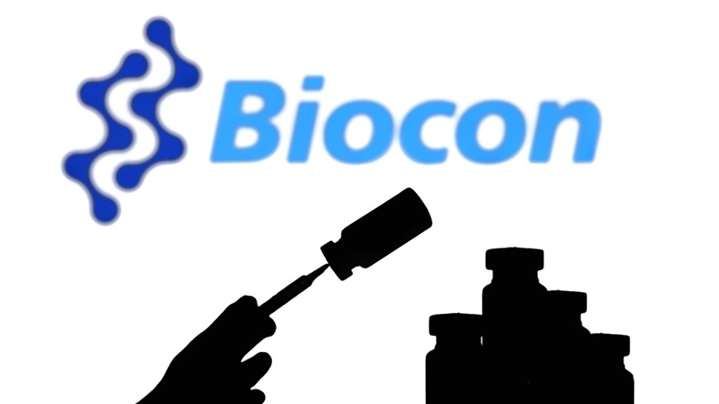 Biocon logo with silhouette of vials and syringe