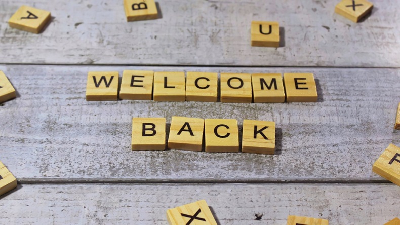 Welcome back spelled out in tiles