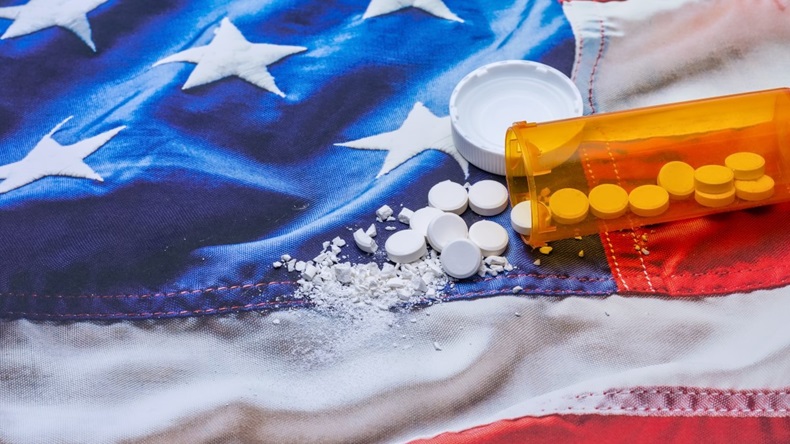US flag with crushed tablets from bottle