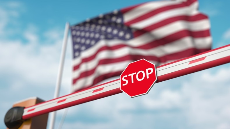 Stop sign in front of US flag