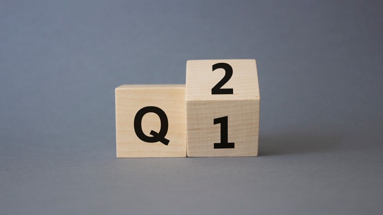 Q1 And Q2 written on a dice