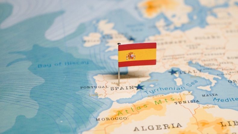 Spanish flag planted on map of Spain