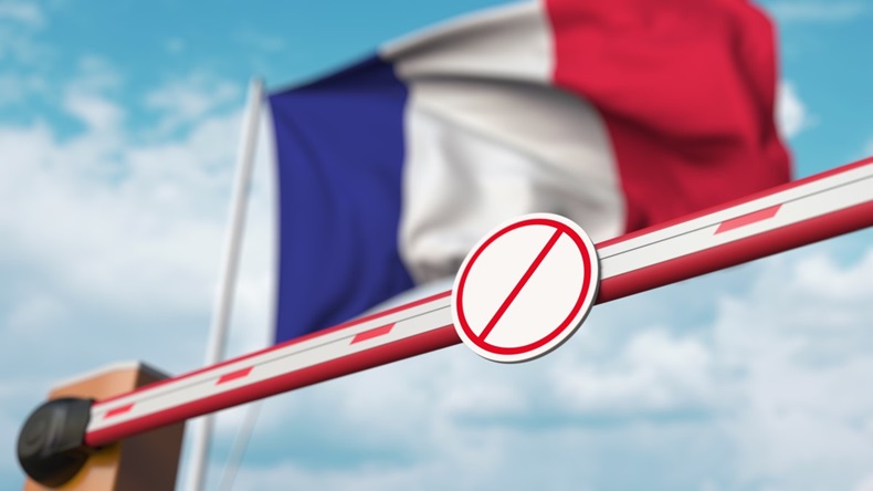 French flag with "no entry" barrier
