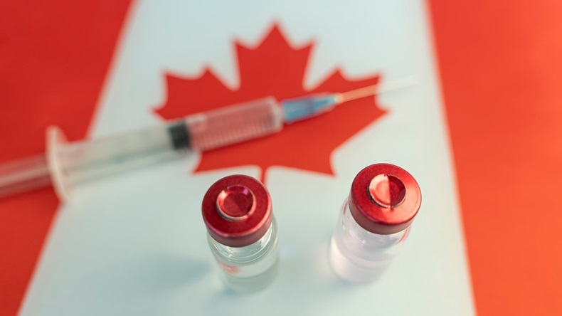 Canadian flag with syringe and vials