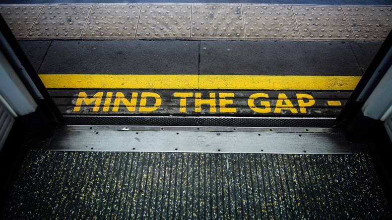 Mind The Gap sign on floor outside train door