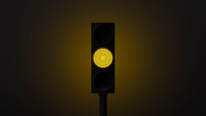 glowing yellow traffic light